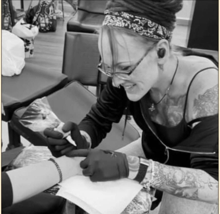 Michelle tattooing a client at Ink Therapy Tattoos in Hamilton